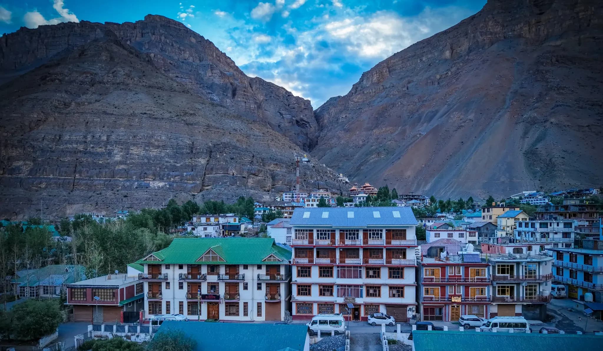 The Delek House among Kaza's rooftops below the bare Spiti mountains